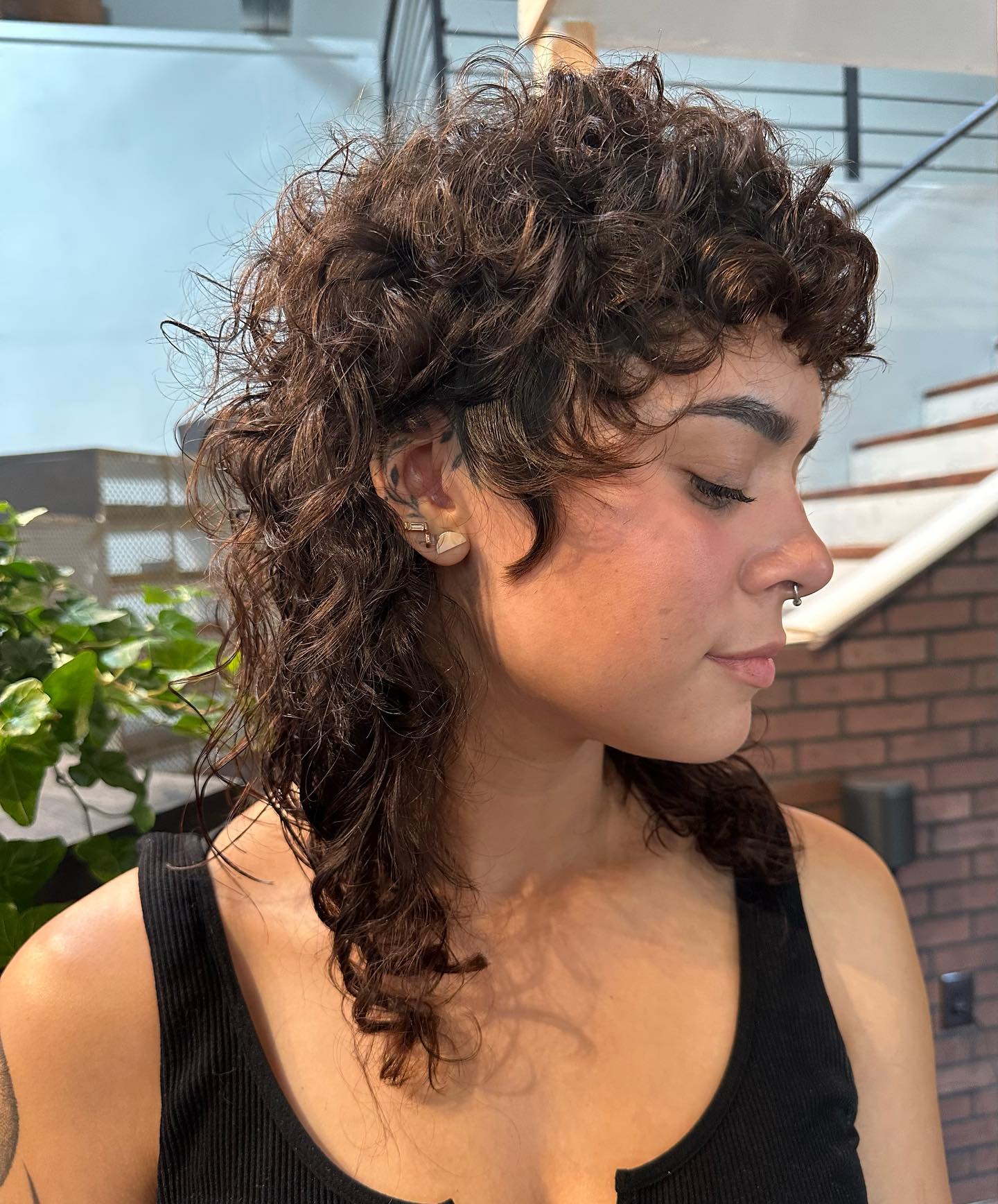 20. Curly Shag with Wispy Bangs