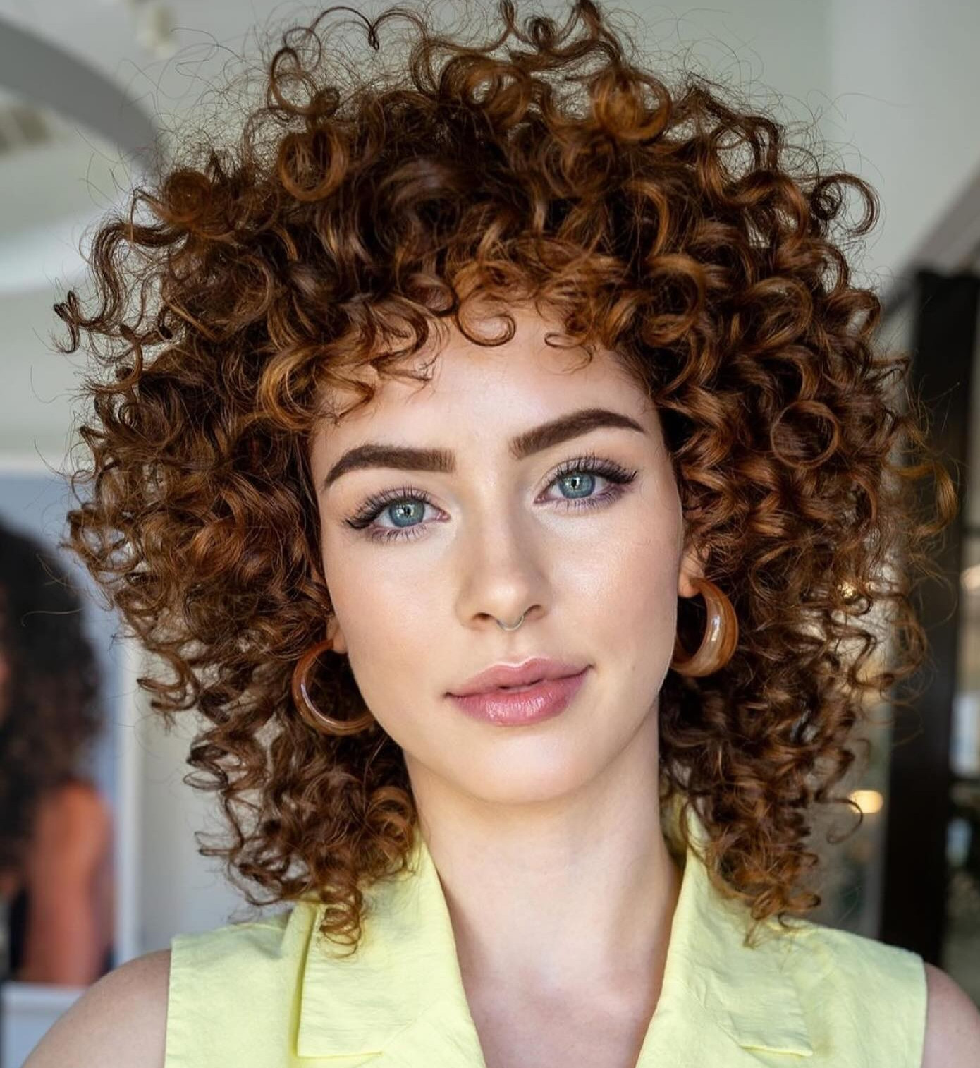 9. Slicked-Back Curly Afro Hairstyle